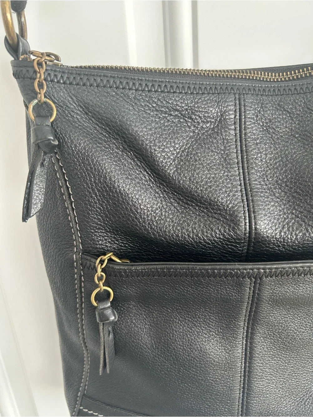 The Sac Iris Black Pebbled Leather Crossbody Bag Adjustable Strap Brass Hardware